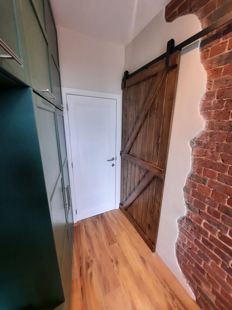 Porte coulissante en bois – Guillaume Menuiserie